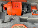 an orange machine that is sitting inside of a box