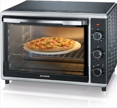 an image of a pizza sitting in a toaster oven