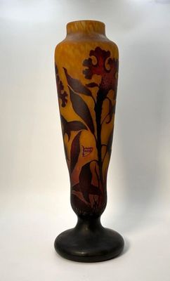 a vase with a flower design on it on a white background