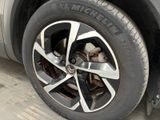 a close up of a tire on a car ' s rim