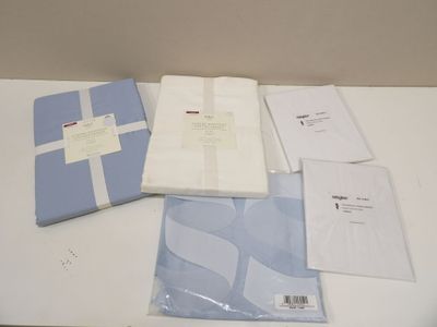 a table that has a bunch of papers and a book on it