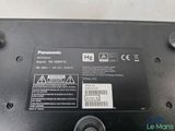 the back side of a laptop with a label on it