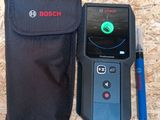 a close up of a cell phone with a case and a pen