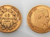 two gold coins, one of which is the head of a man and the other of a woman