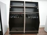 a black cabinet with a bunch of clothes hanging on it