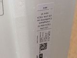 a close up of a white refrigerator with a sticker on it