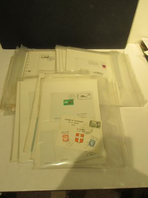 several envelopes are sitting on a table next to a computer