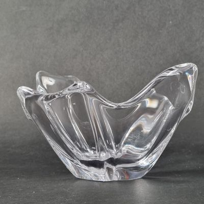a glass bowl that is sitting on a table