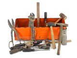 many different tools in a wooden box on a white surface