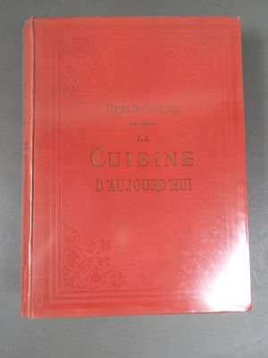 a close up of a red book on a table