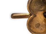 a small metal object with a heart on it