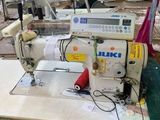 an image of a sewing machine in a factory