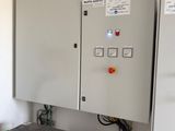 an electrical panel in the corner of a room