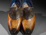 a close up of a pair of shoes on a table