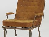une image représentant une chaise dont l'assise est recouverte d'un tissu marron