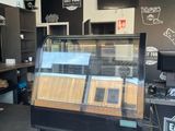 an image of a coffee shop with a display case