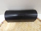 a close up of a black cylinder on top of a basket