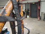 an image of a fork and some tools in a garage