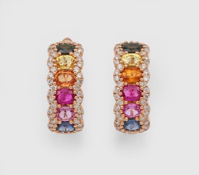 a pair of multicolored sapphire and diamond earrings
