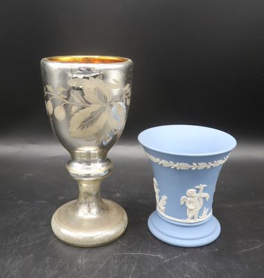 two vases sitting next to each other on a table