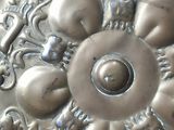 a large metal plate with a design on it