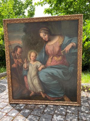 une peinture ancienne représentant une femme tenant un enfant sur ses genoux