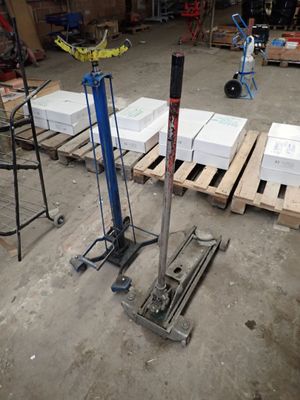 several pallets of white boxes are stacked on pallets in a warehouse