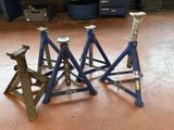 several pieces of metal sit on top of each other in a garage