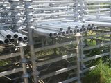 a lot of pipes that are sitting in the grass