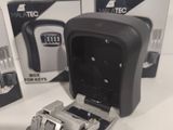 a box of batteries and a charger on a table