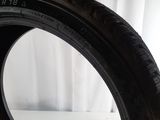 a close up of a tire on a table with a white background