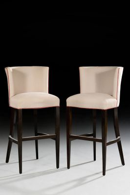 pair of upholstered bar stools with upholstered backrests