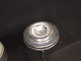 a metal object that is sitting next to a can