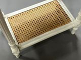 an image of a white table with a wicker seat