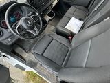 a view of the inside of a van from the driver ' s seat
