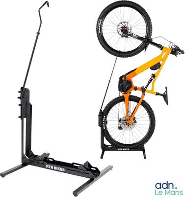 the bike stand is holding two bikes on it ' s sides