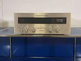 a silver radio sitting on top of a blue counter