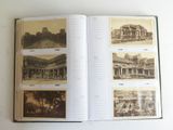 an open book with pictures of buildings on it