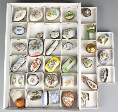 a white box filled with assorted porcelain objects