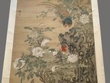 an old chinese painting of a bird and flowers on a wall