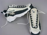 pair of white and black sneakers with laces on them