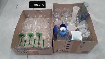 two boxes of empty wine glasses and a bottle in them