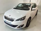 the small white car is parked in the white room