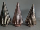 three metal cones that are sitting on a table