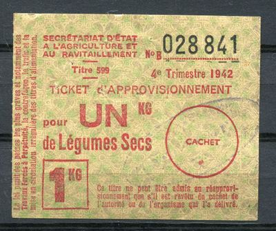 a ticket with a red stamp on it on a black surface