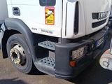 a white truck that is parked on the side of the road