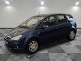 a picture of a small blue car parked in a garage