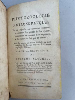an open book with a picture of a bird sitting on top of it