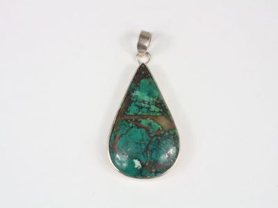 a green turquoise turquoise stone tear shaped pendant on a white background