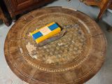 a table with a book on top of it in a room